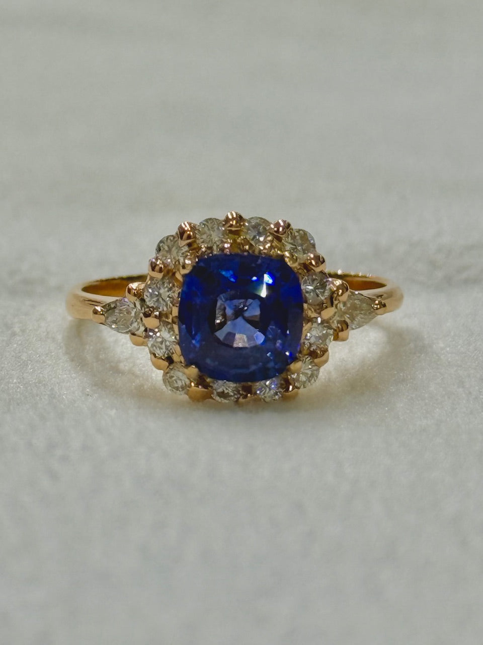 Love in Bloom: Sapphire Halo Ring in Rose Gold