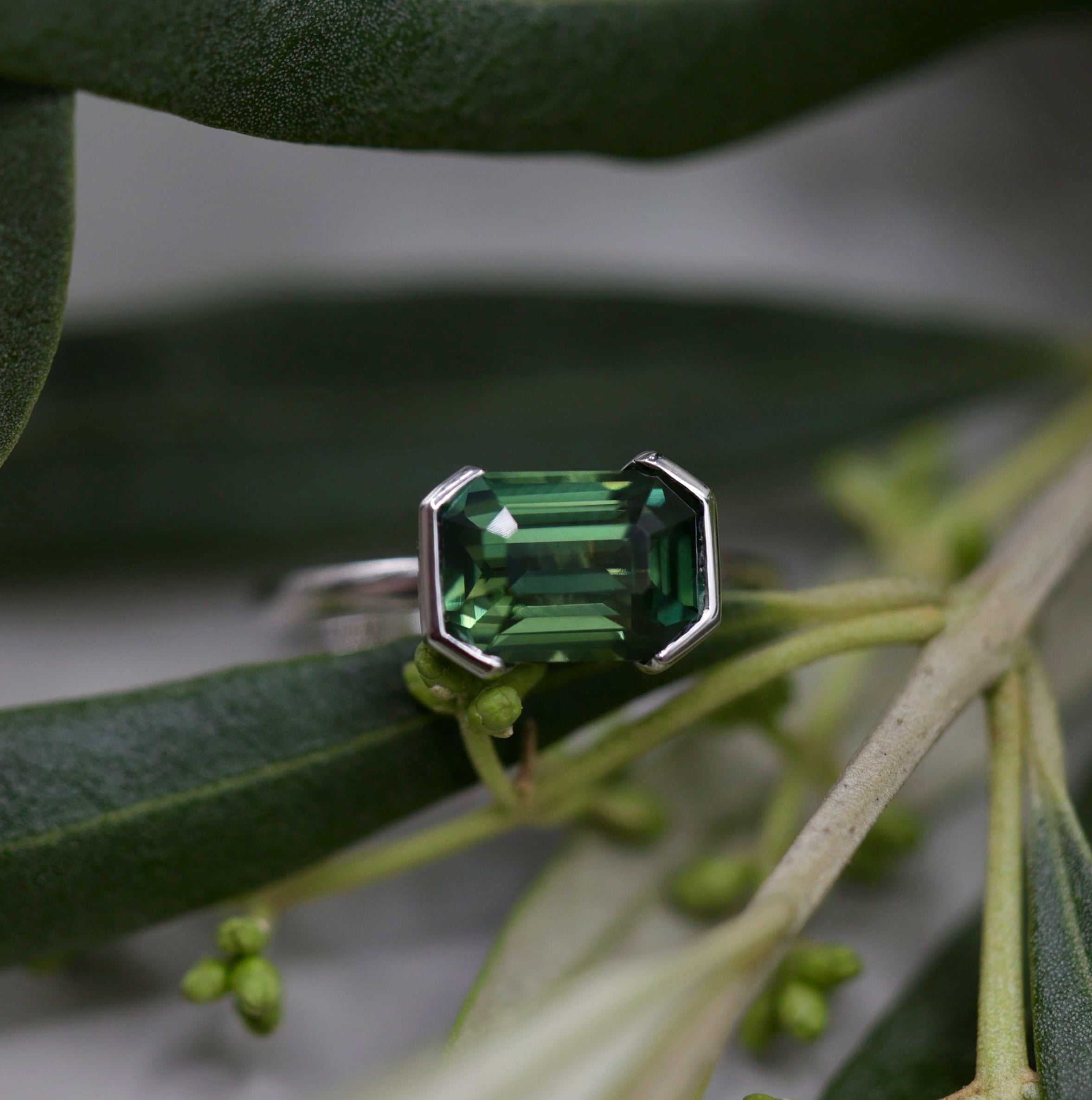Nature's Geometry | An Emerald-Cut Teal Sapphire Solitaire Crafted in 18Kt White Gold