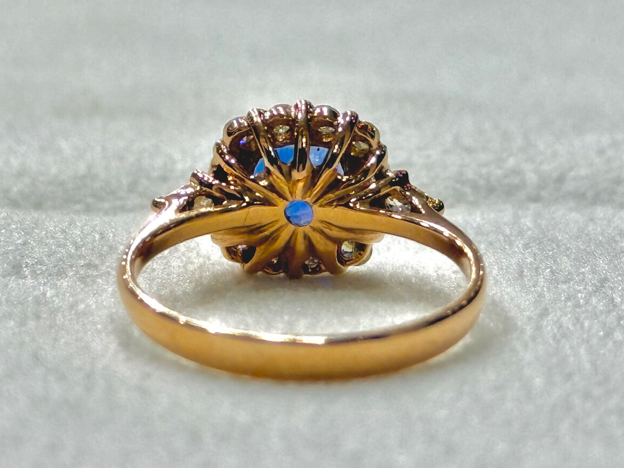 Love in Bloom: Sapphire Halo Ring in Rose Gold